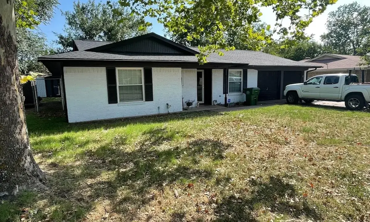 Professional roofing crew working on a residential roof in Rockdale